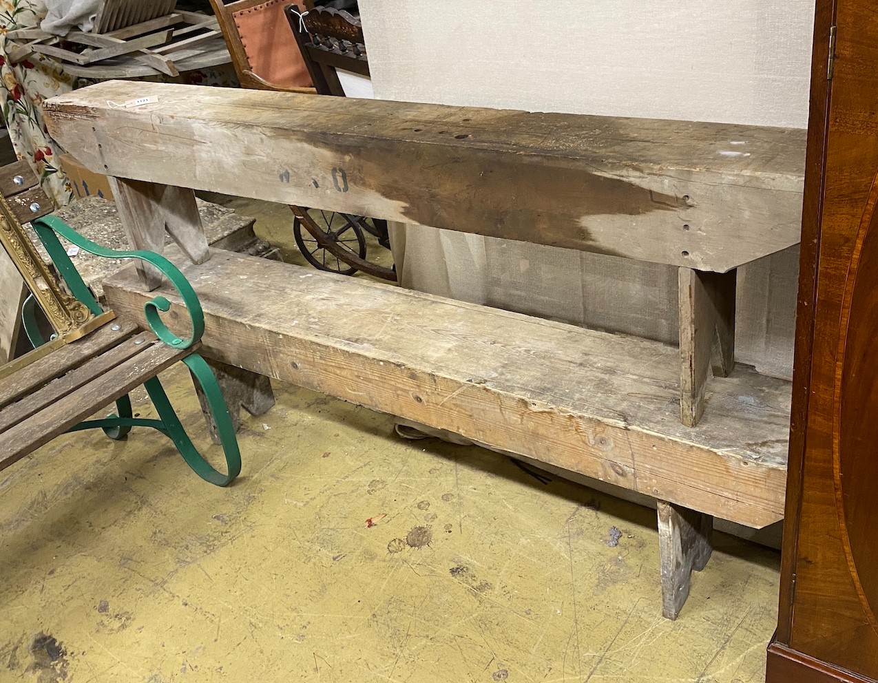 A pair of provincial pine benches, length 183cm, depth 21cm, height 48cm